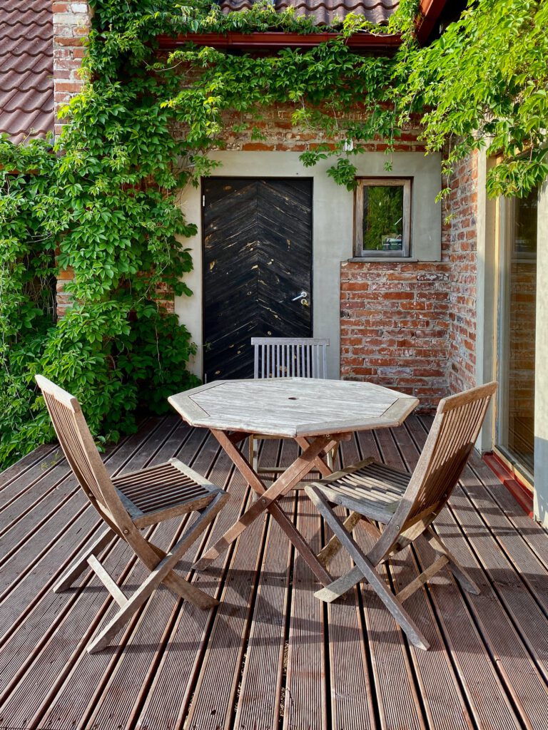 terrace with wooden table and chairs