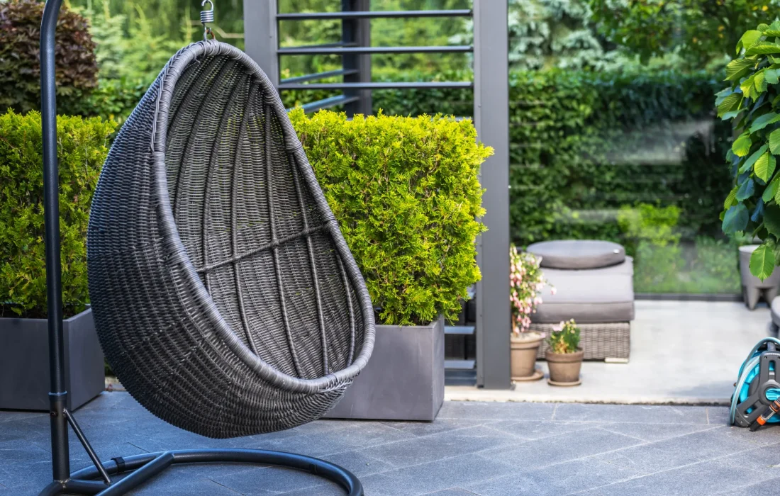 wicker-egg-chair-hanging-in-a-lush-backyard-patio-2026-01-09-06-53-06-utc-scaled.webp